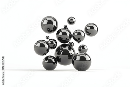 A cluster of glossy, black spheres against a white backdrop