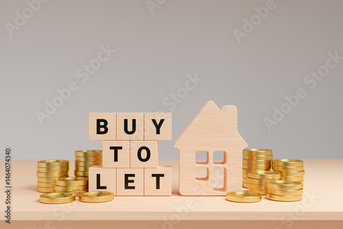 Foto BUY TO LET text on wooden cube with house and gold coins on table, leasing busin