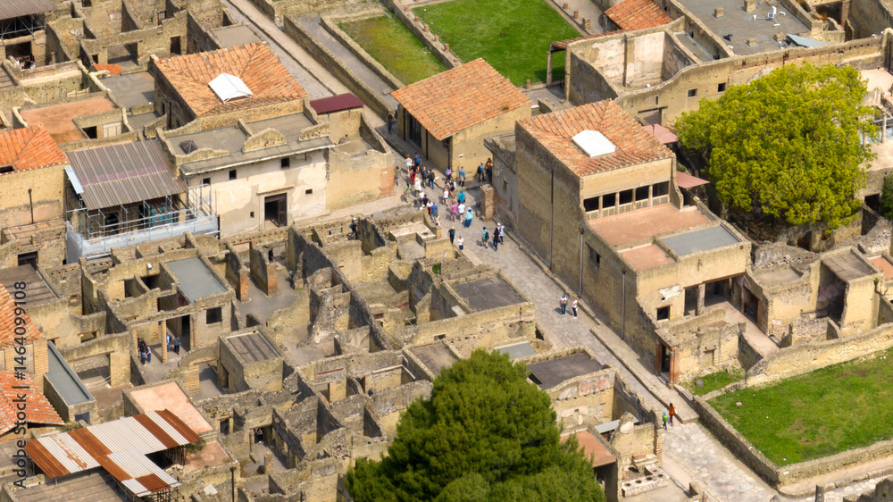 Fototapeta premium Aerial view of the ruins and excavations of Herculaneum. It is an archaeological area of ​​an ancient Roman city, near Pompeii, in the province of Naples, Italy. It is a tourist destination.