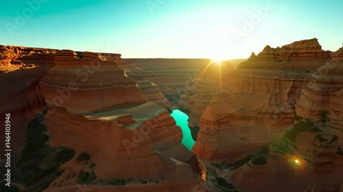 Geometric Canyon Landscape at Dawn with Radiant Orange and Teal Hues
