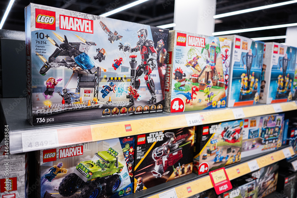 Naklejka premium Lego sets on store shelves featuring Marvel, Star Wars, and more themes