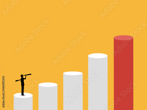 Visionary businessman looking at growth on bar chart