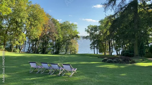 Lawn Chairs Overlooking Lake and Trees