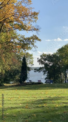 Autumn Lakeside View with Lawn Chairs