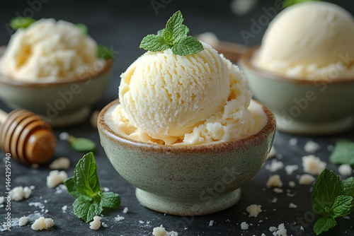 Obraz na płótnie Creamy Vanilla Ice Cream Scoop with Mint Garnish in Rustic Bowls for Gourmet Dessert Presentation w salonie