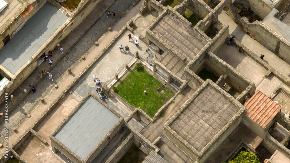 Fototapeta premium Aerial view of the street, ruins and excavations of Herculaneum. It is an archaeological area of ​​an ancient Roman city, near Pompeii, in the province of Naples, Italy. It is a tourist destination.