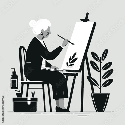 Senior woman painting a leaf illustration in a cozy studio  