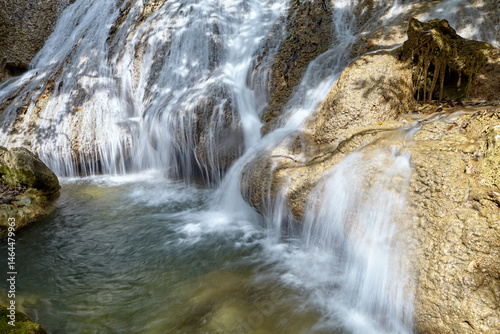 Scenic view of waterfall in tropical rainforest  photo