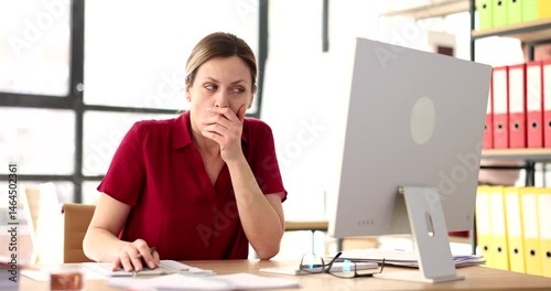 Male manager whispers secret to surprised female colleague sitting at desk in office. Man shares confidential information and gossiping at workplace