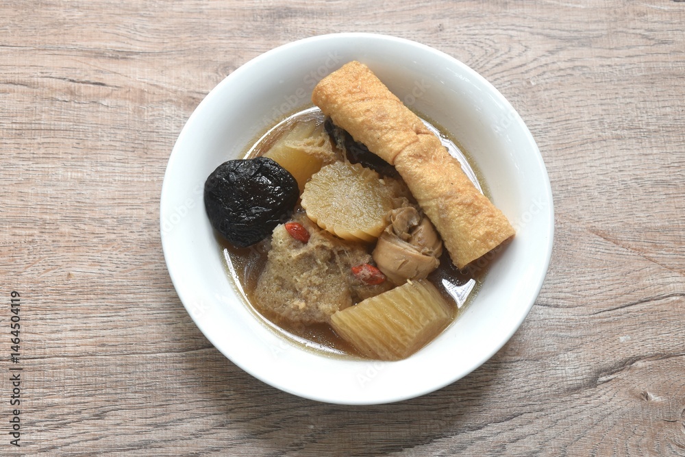 boiled slice radish with tofu and black mushroom soup vegetarian food on bowl