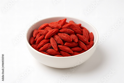 Close-up of a Bowl Filled with Goji Berries on a White Surface