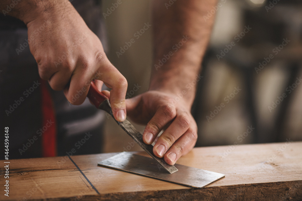 Young carpenter working in his workshop Young carpenter working in his workshop