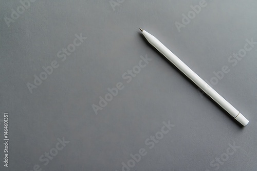 White Stylus Pen on Grey Background Minimalist Design
