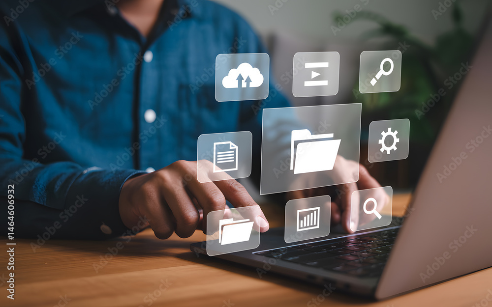 Naklejka premium Person using laptop with cloud storage and data management icons representing digital technology
