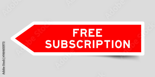 Red color arrow shape sticker label with word free subscription on gray background