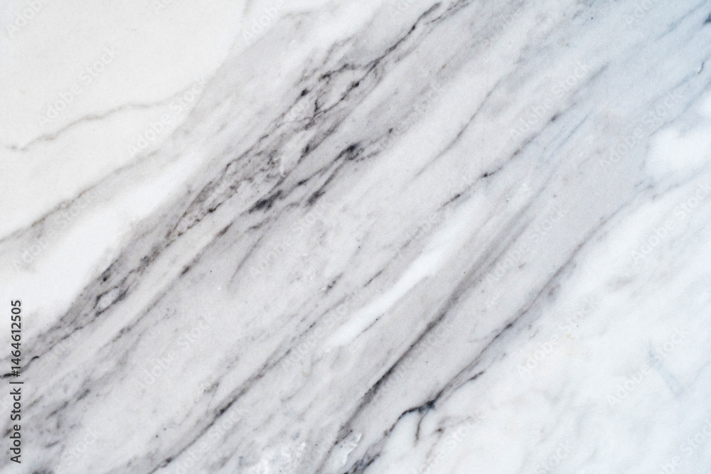 Detailed close-up reveals the intricate veins and subtle textures of white marble. Abstract natural backgrounds Detailed close-up reveals the intricate veins and subtle textures of white marble. Abstract natural backgrounds