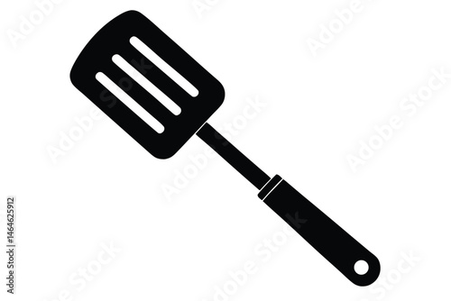 A solid black spatula with three slots is seen against a white backdrop