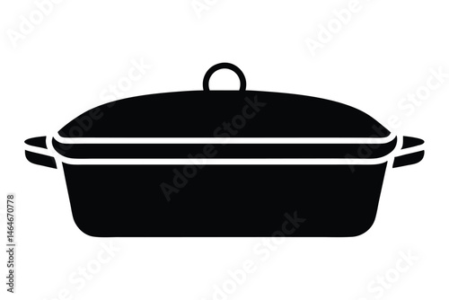 The covered black casserole dish with handles and lid is isolated on white