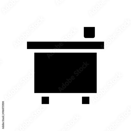Minimalist black silhouette depiction of a simple small desk and cube