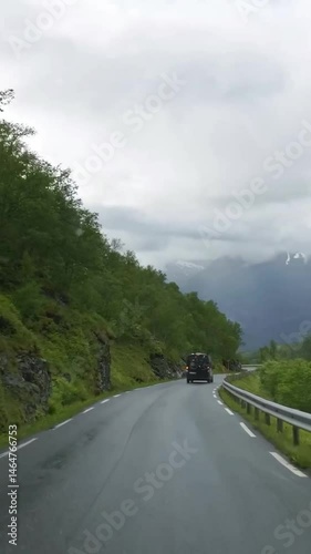 Vertical view of Norway road from car
