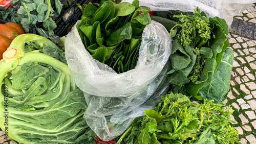 Verdant leafy bounty at rustic market, earths emerald riches evoke rustic charm, Earth Day celebration, verdure vitality