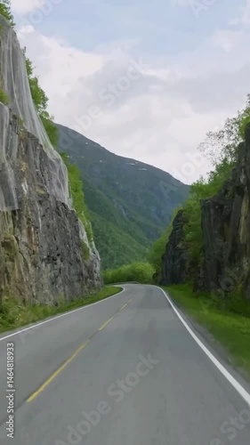 Vertical view of Norway road from car