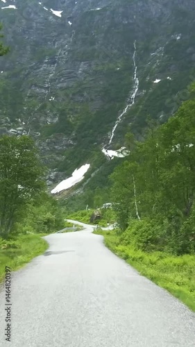 Vertical view of Norway road from car