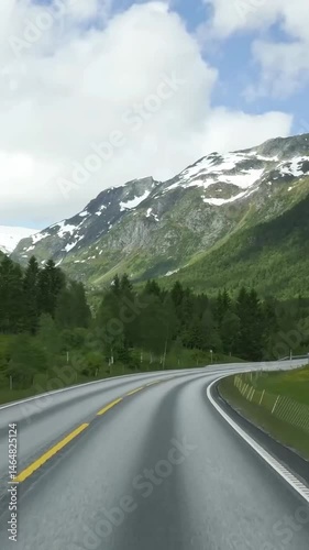 Vertical view of Norway road from car