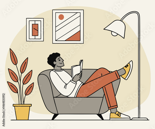 Relaxed Man Reading Book in Comfortable Armchair at Home.