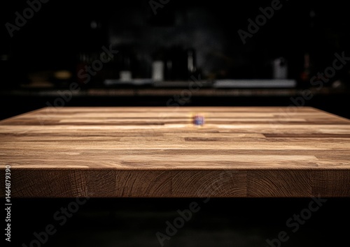 Wooden table top in dark kitchen background photo