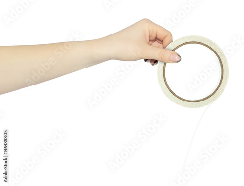 Fotografie double sided adhesive tape in hand, outstretched hand with roll of narrow double
