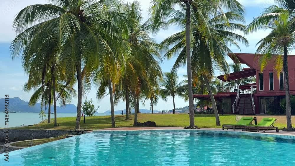 view of the hotel territory with a swimming pool and palm trees, rest in the hotel view of the hotel territory with a swimming pool and palm trees, rest in the hotel