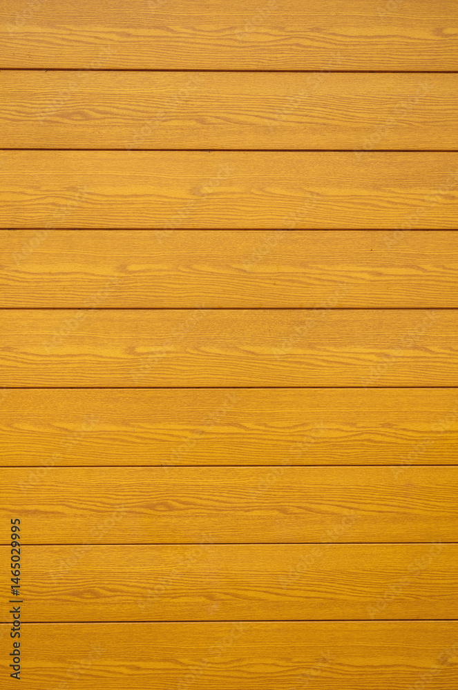 Fototapeta premium Sunlight on Lacquered Oak Panels with Parallel Lines.