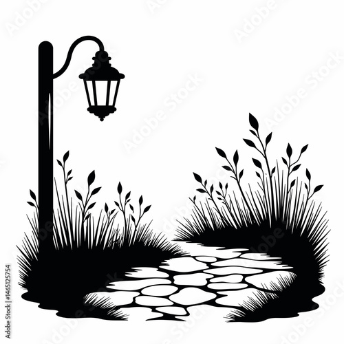Garden lantern illuminates a stone path in black and white