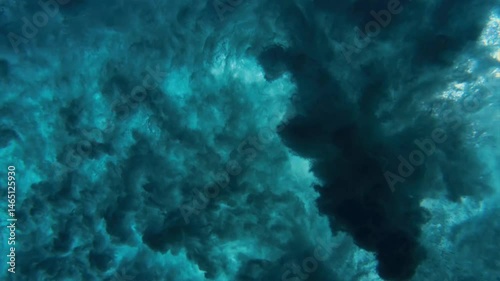 Underwater filming of the twisting waves of the sea water, stunning. The water circulates, and the waves merge into each other.