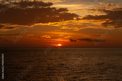 beautiful cloudy sunset sky with sun lighting.