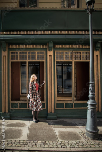 young beautiful woman in vintage suit in european city
