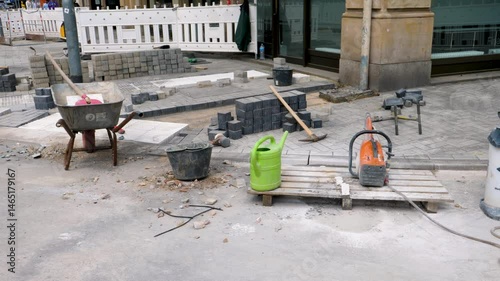 Laying of paving stones - sand and asphalt on sidewalk