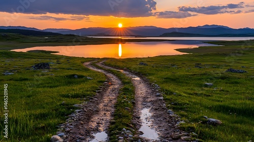 Sunset over Serene Tundra Landscape with Winding Road