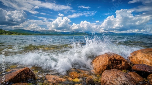 Fototapeta Naklejka Na Ścianę i Meble -  Ocean Water Splashing on Rocks on Sunny Day.