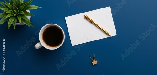 Dark blue desk, coffee cup, notepad, gold pen & clips, top view,  gold,   professional