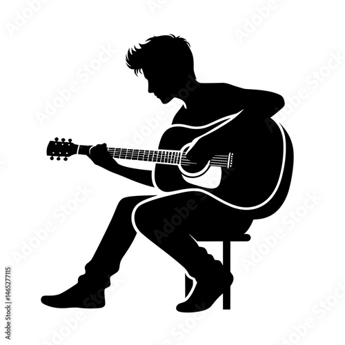Silhouette of a musician playing guitar while sitting  