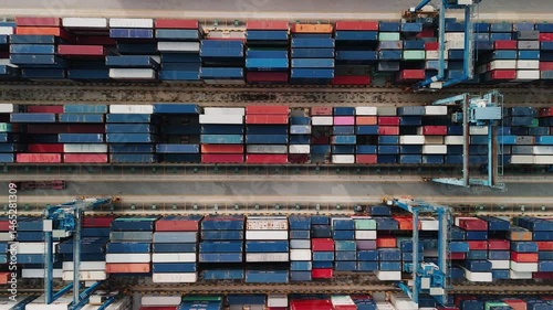 Multicolored freight containers stacking vertically at port klang, symbolizing international maritime logistics infrastructure