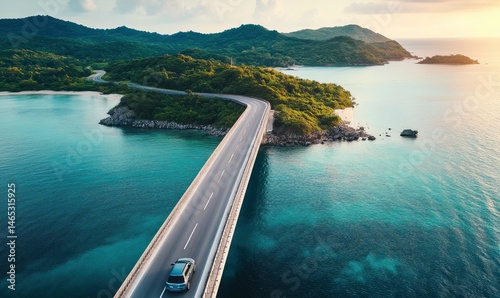 Car on Bridge Road Over Turquoise Water