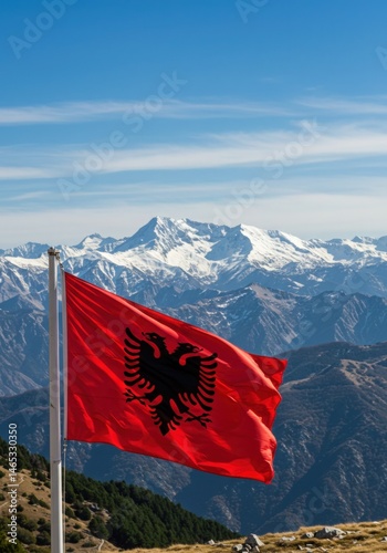 Waving Albanian Flag with Double-Headed Eagle Against the Dramatic Peaks of the Albanian Alps