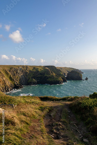 Mullion Cove Clifftop View with Turquoise Waters and Rugged Cliffs