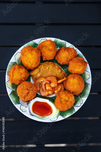 Acaraje, typical street food from northeastern Brazil, African cuisine fried with shrimp
