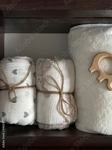 Muslin diapers, a terry towel in the drawer of the bedside table. Preparing for the birth of a child