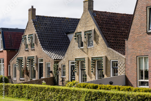 Fototapeta Naklejka Na Ścianę i Meble -  Townscape with picturesque small houses of village and island Schiermonnikoog in The Netherlands