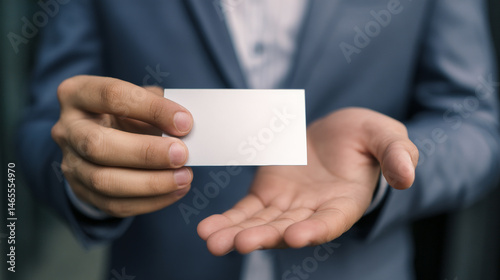 A close-up of a well-dressed man’s hand holding an empty card, symbolizing potential and opportunity. Generative AI